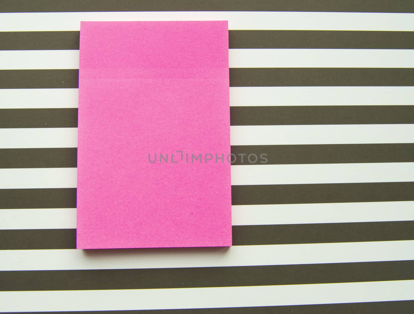 Red message sticker on black and white striped background, business objects by claire_lucia