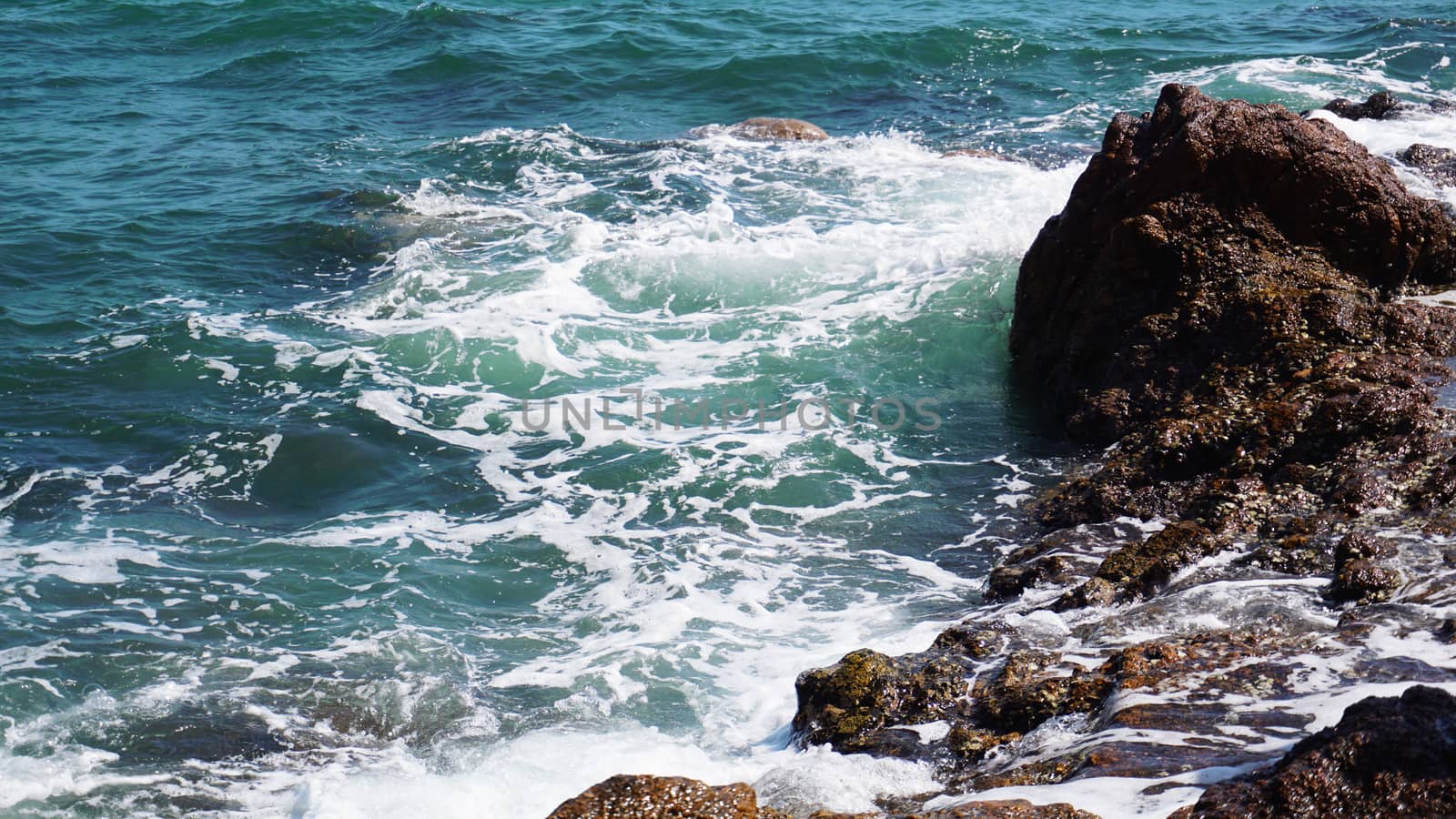 Aerial view of ocean waves and fantastic Rocky coast - Summer vacation and nature travel adventure concept.