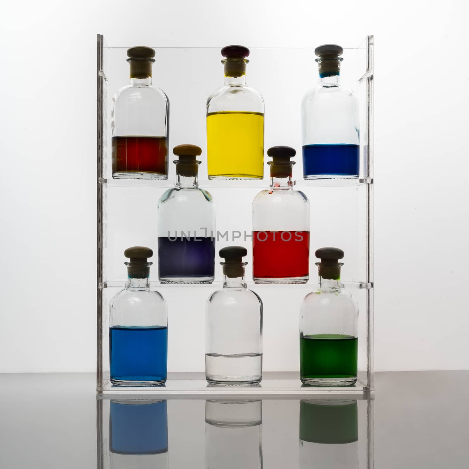 Small glass bottles containing colored liquid