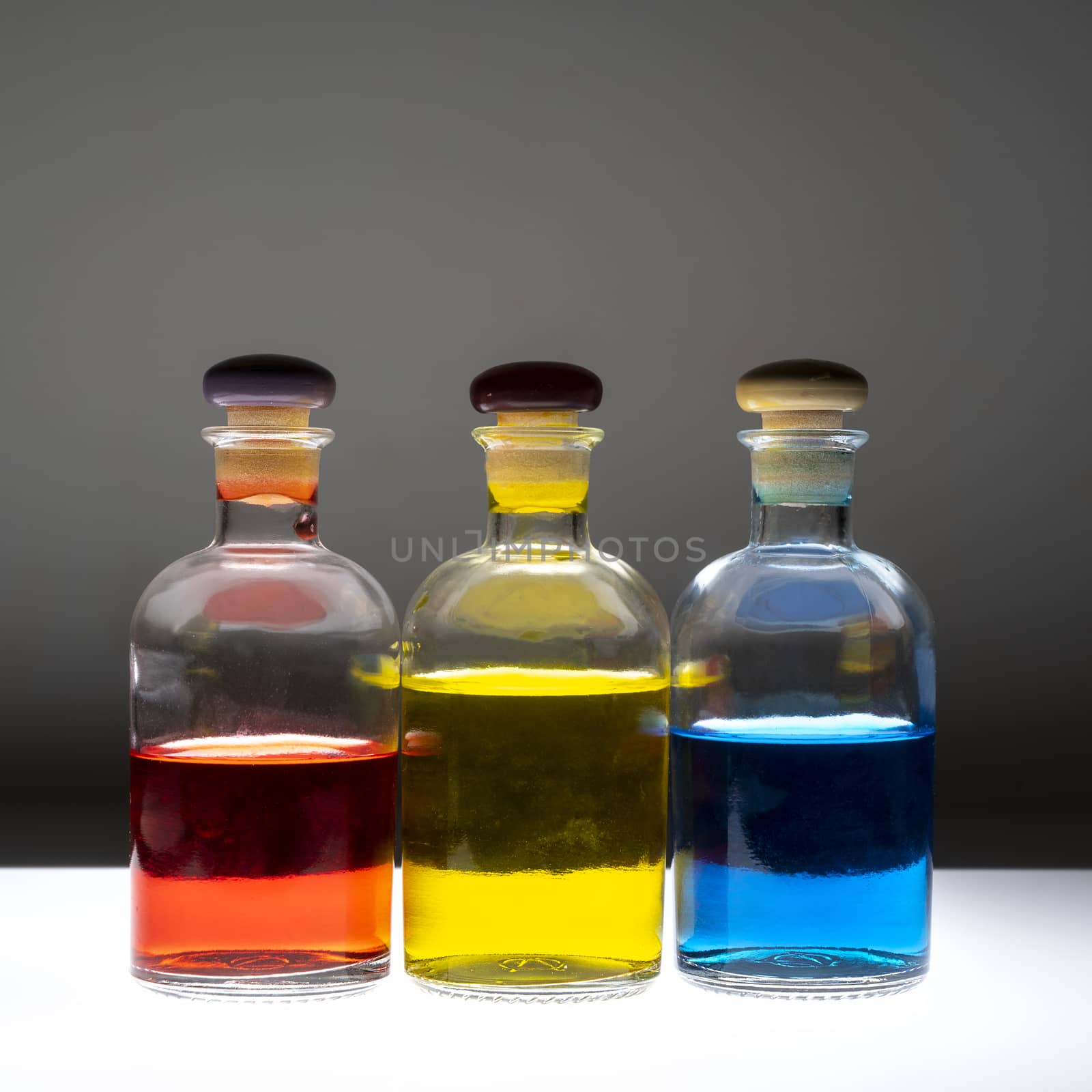 Bottles with colored liquid by sergiodv