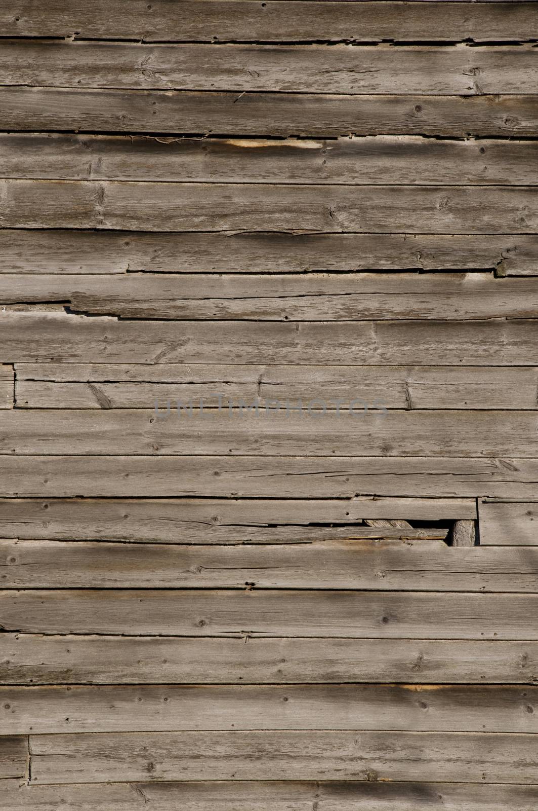 Weathered wooden wall with unpainted planks by Balefire9