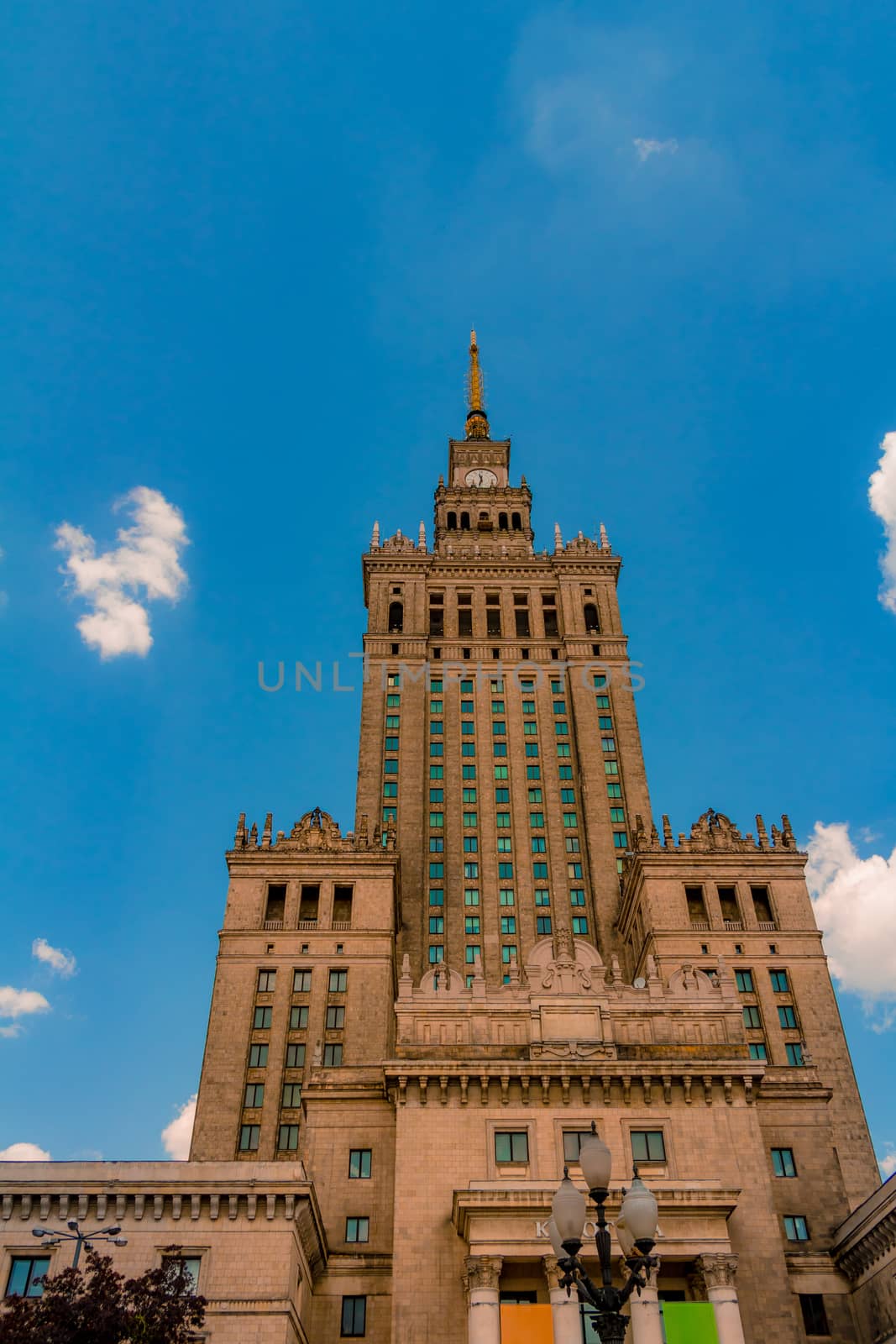 The Palace of Culture and Science of Warsaw from a low angle view. An historical public cultural institution and the tallest building in Poland.