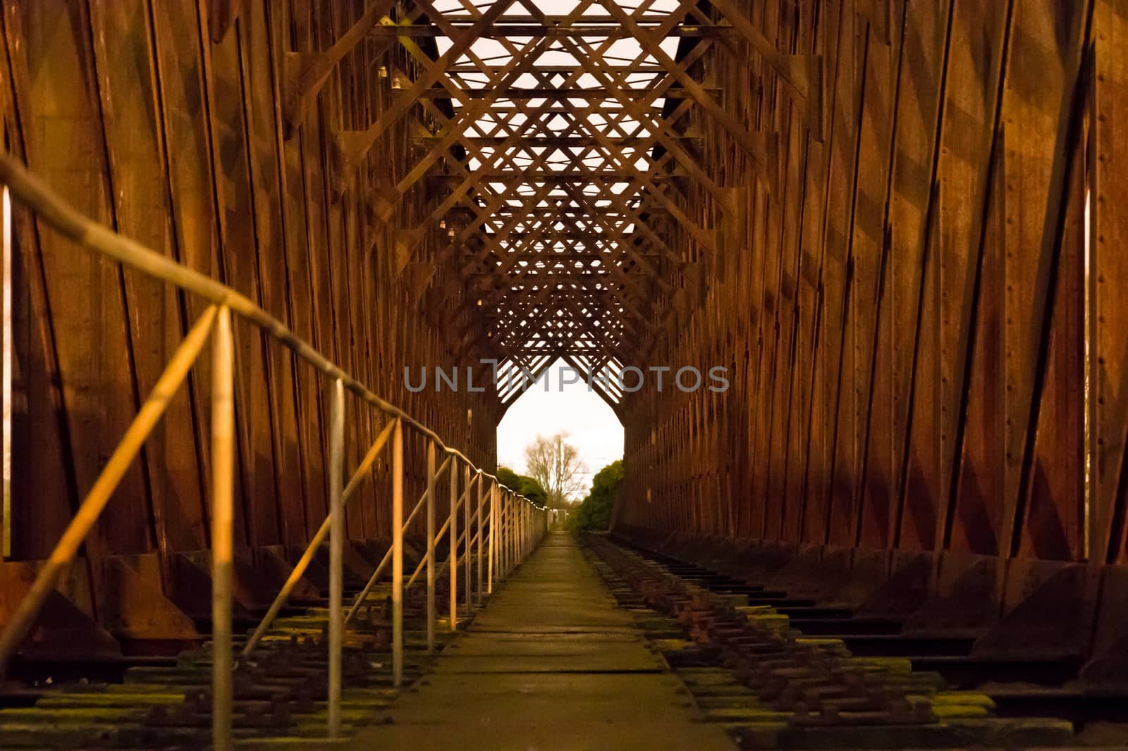 Old industrial railway railroad iron bridge center perspective n by MXW_Stock