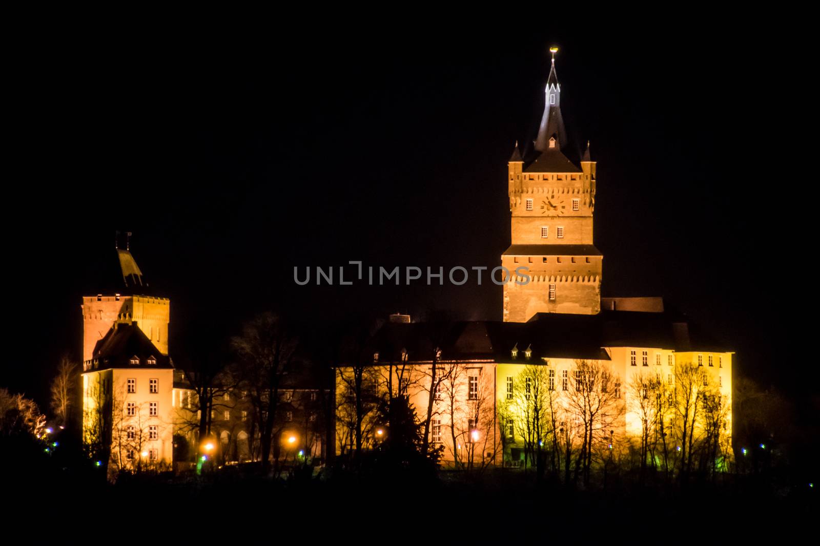 Old german castle tower clock palace at night by MXW_Stock