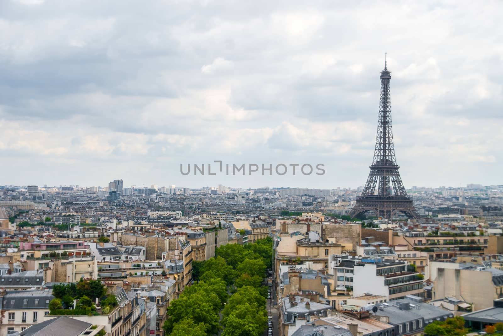 View over Paris Eiffel Tower cloudy sky city center by MXW_Stock