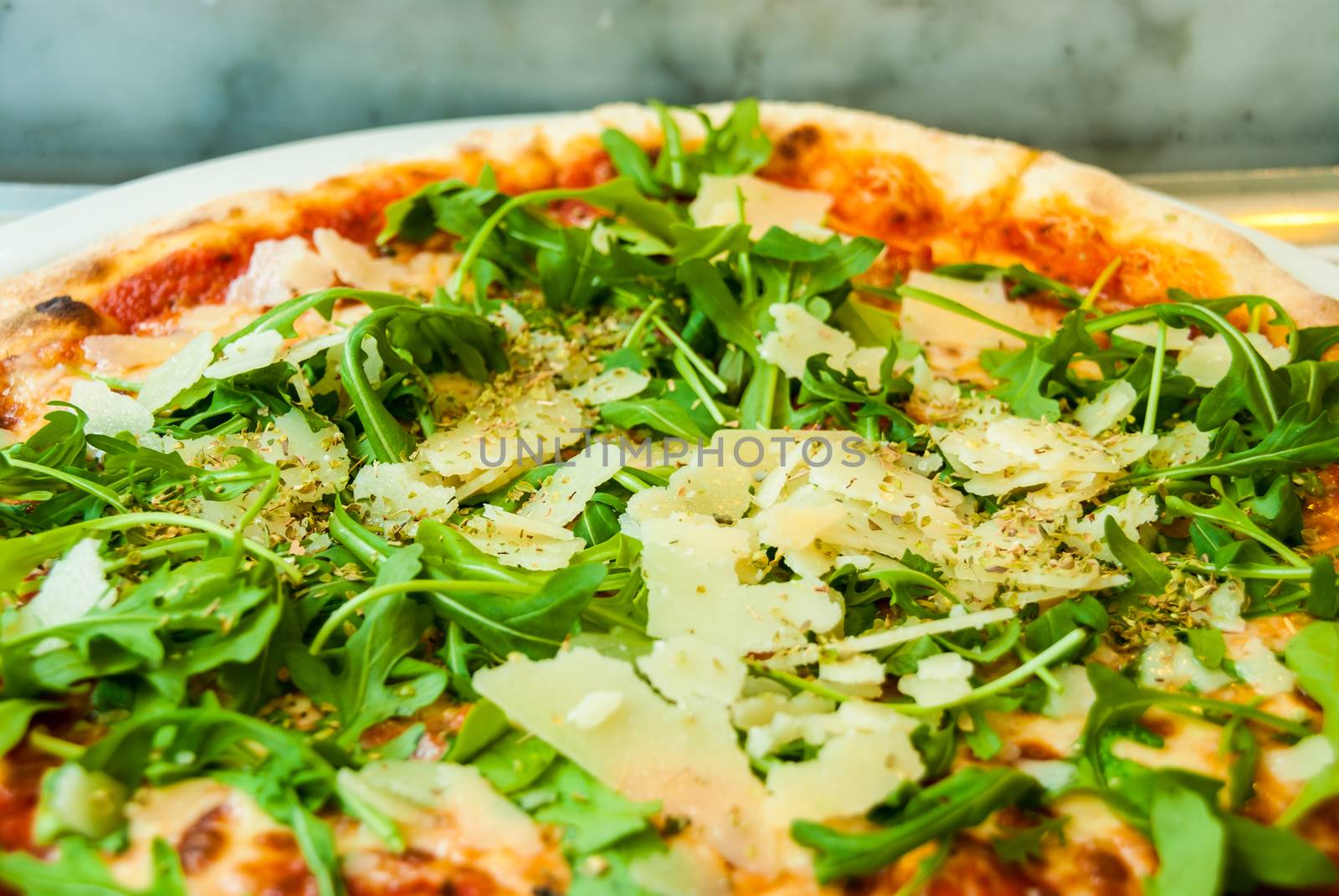 Pizza parma arugula ham parmesan tomato italian by MXW_Stock