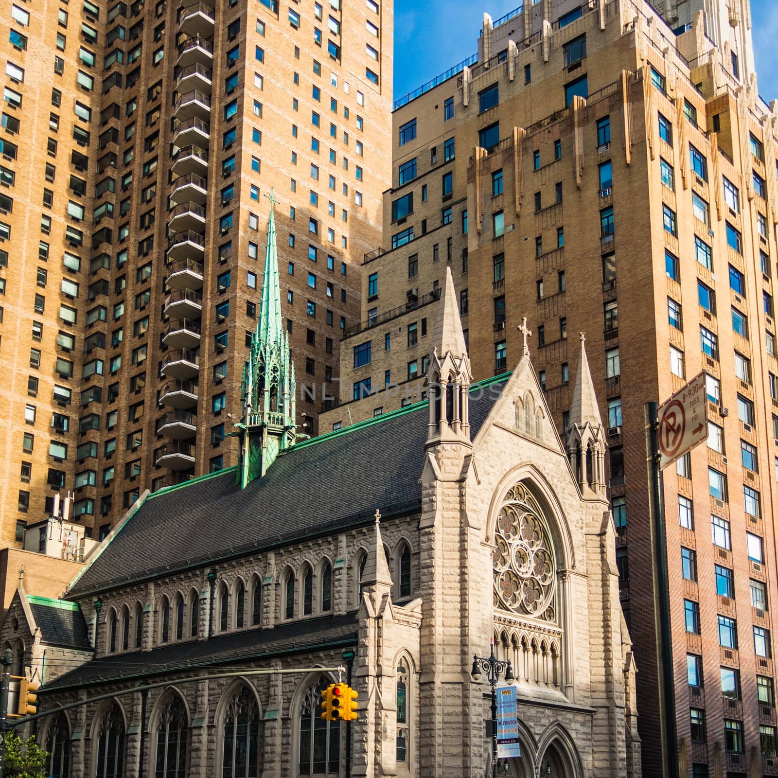 Church in New York Manhattan caught by the modern skyscrapers by MXW_Stock