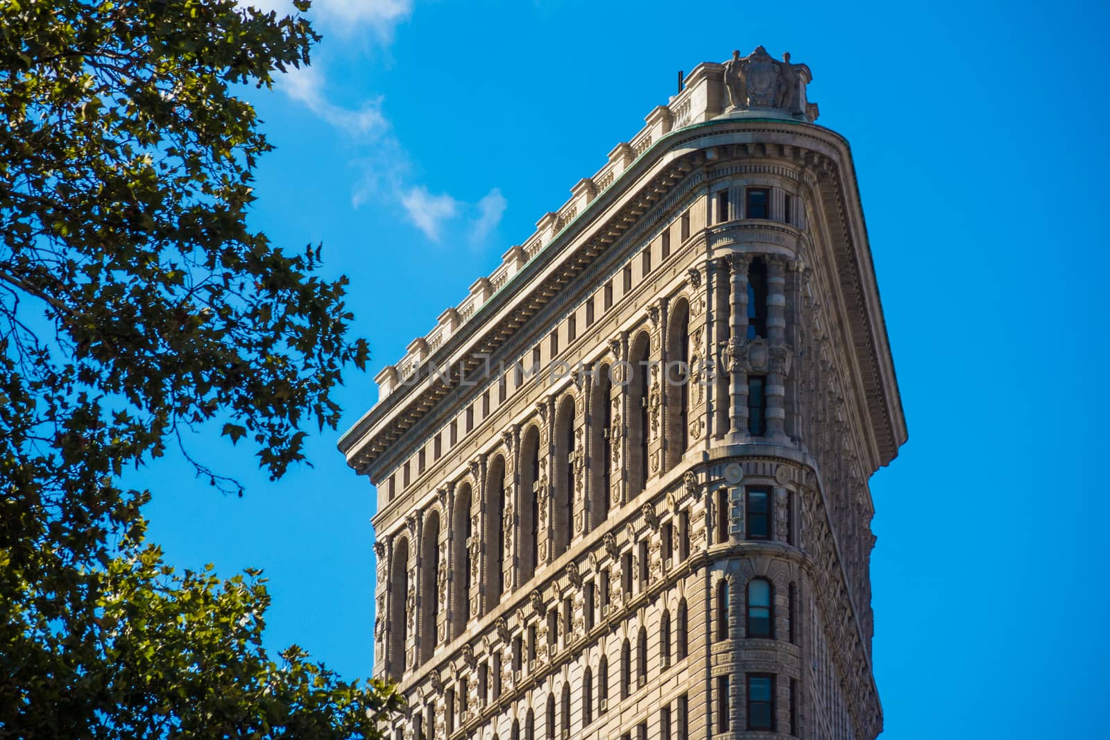 Close up Flat Iron building New York Manhattan stone and steel s by MXW_Stock
