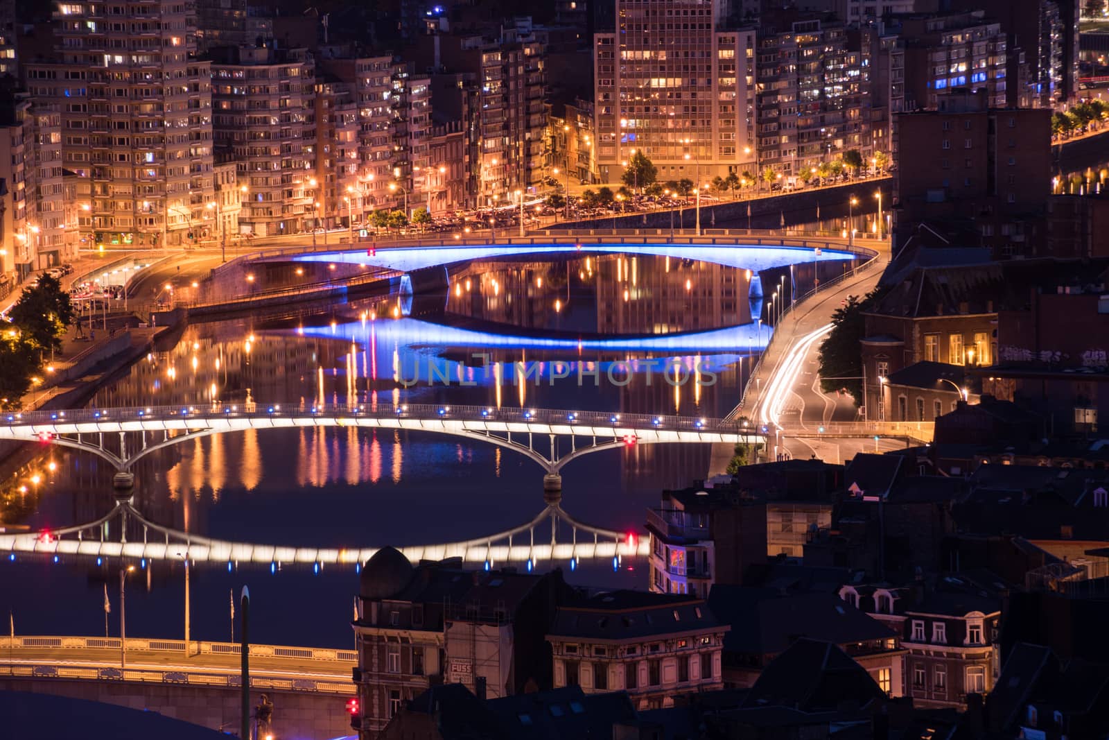 Bridges of Liege Belgium with light show over river Maas