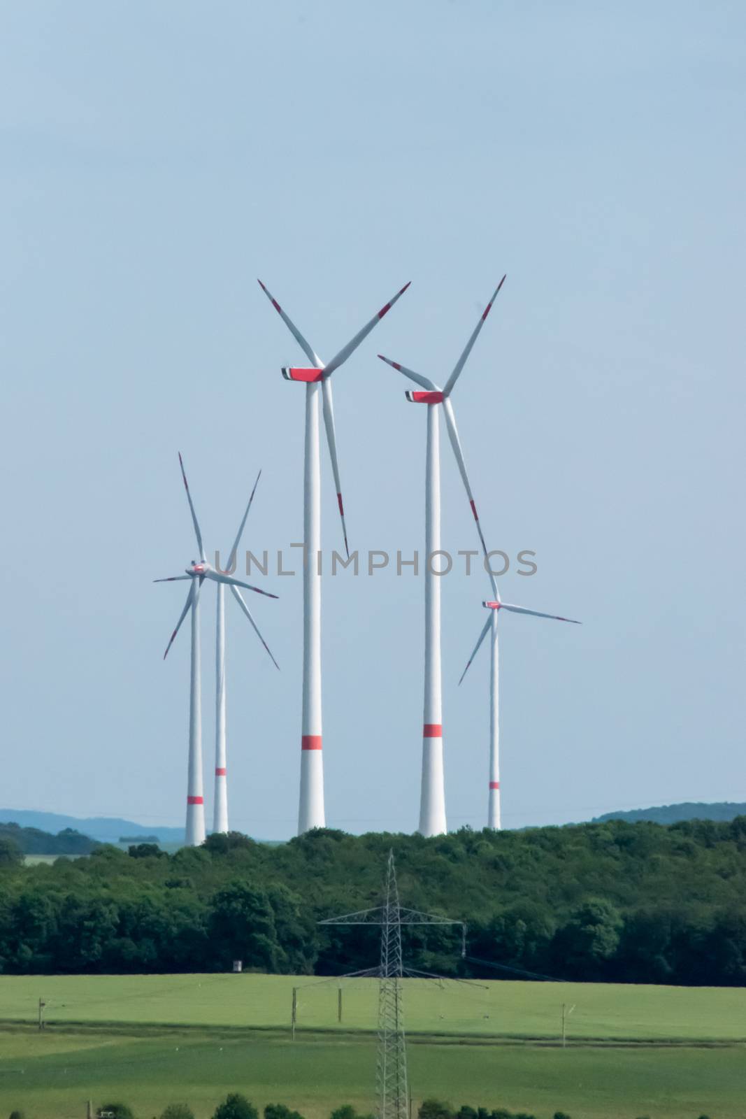 Wind turbines generators in German landscape by MXW_Stock