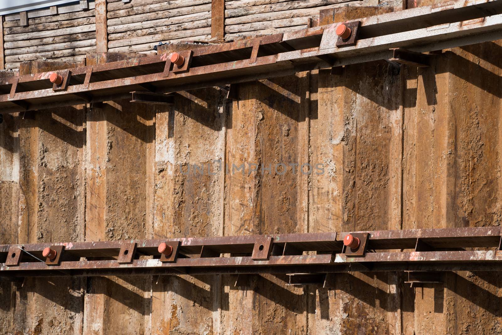 Sheet piling pile wall with soldier pile wall