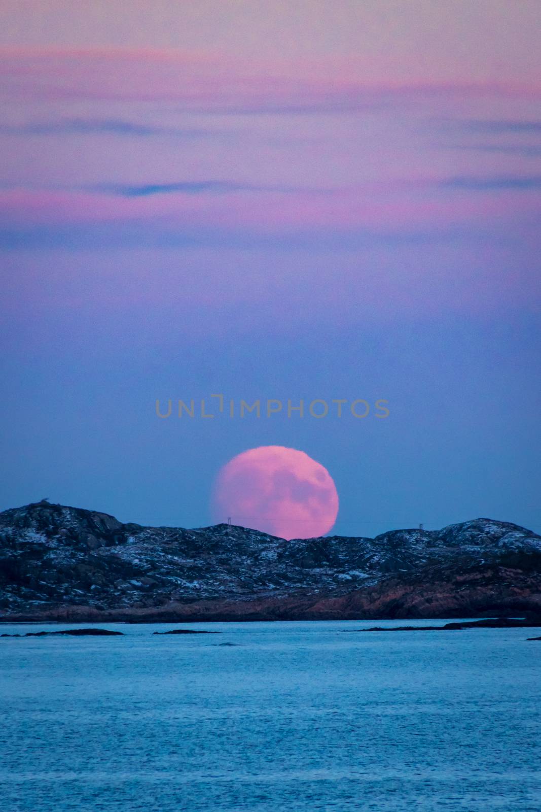 Moonrise at Skandinavian winter red blood moon