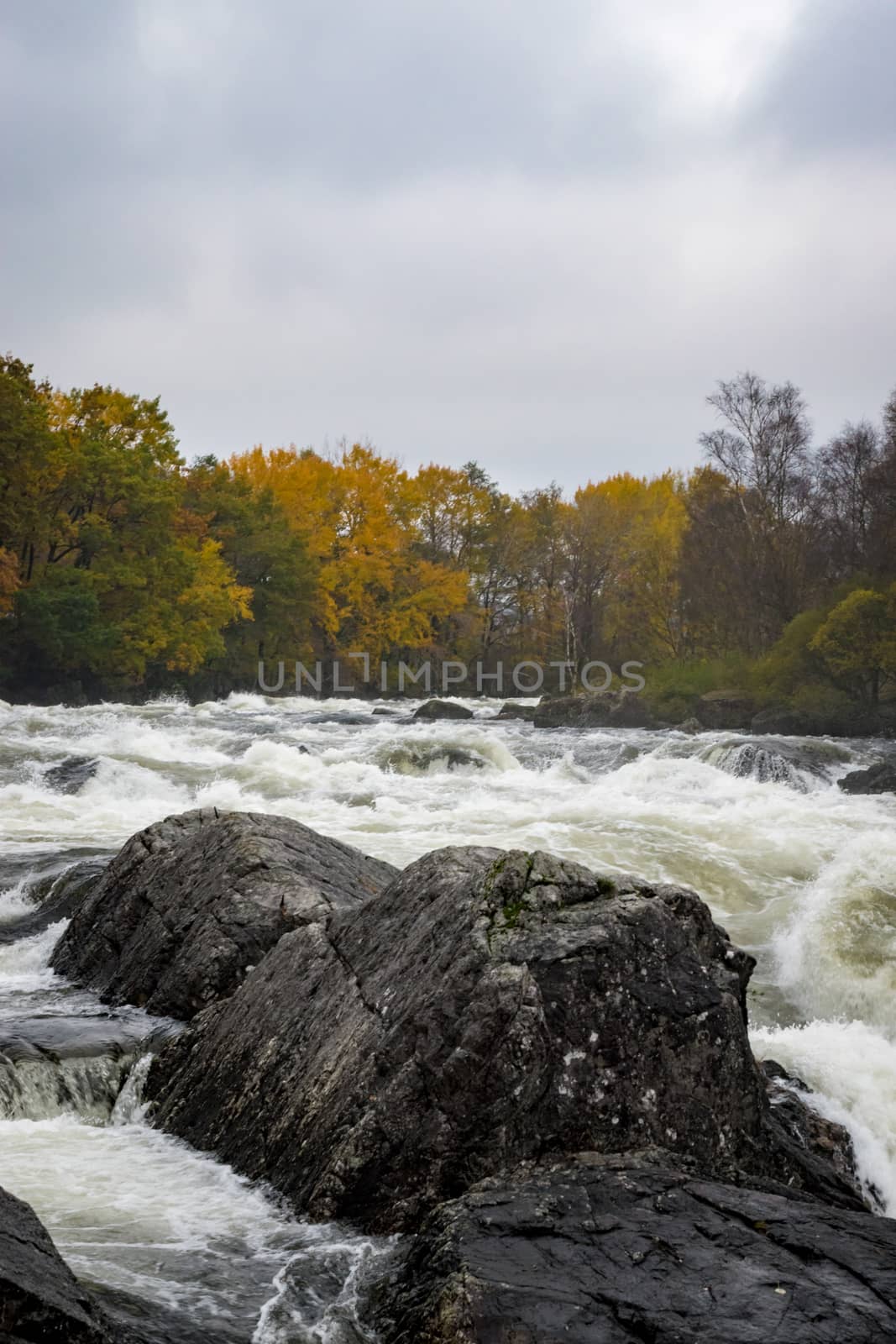 Rapid stream fall Norway water with rocks by MXW_Stock