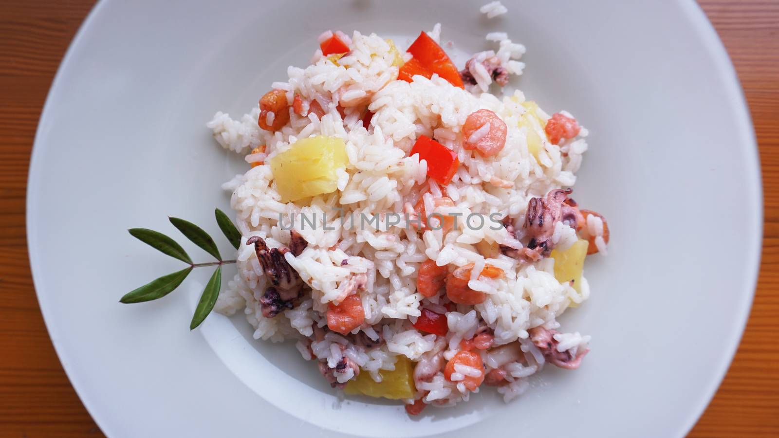 Rice with with shrimp and pineapple, thai or china food on white dish