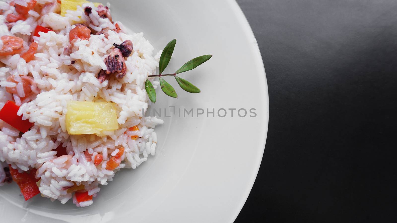 Rice with with shrimp and pineapple, thai or china food on white dish