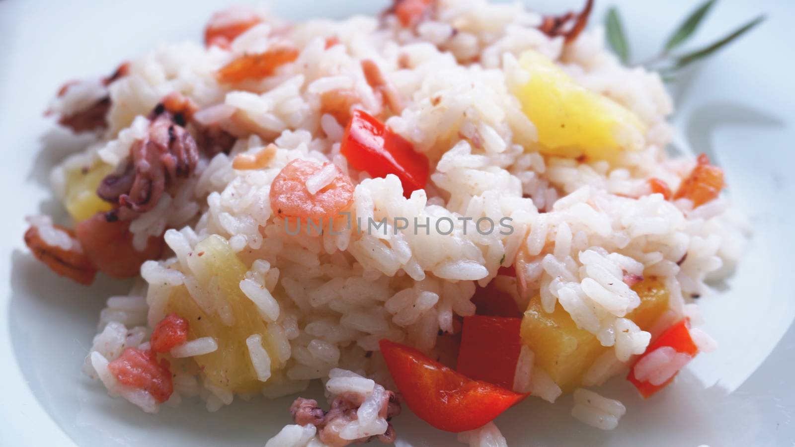 Rice with with shrimp and pineapple, thai or china food on white dish