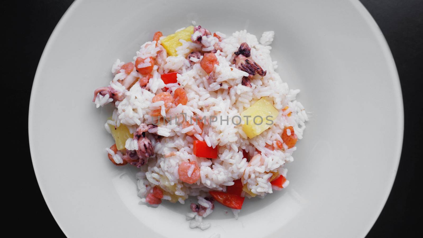 Rice with with shrimp and pineapple, thai or china food on white dish