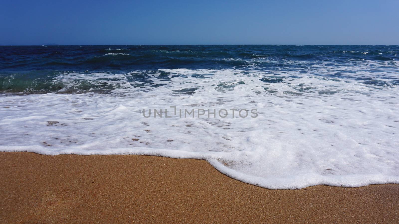 Tropical beach. Ocean wave background. Sand and blue sea. Ocean water nature, beach relax. Summer sea vacation