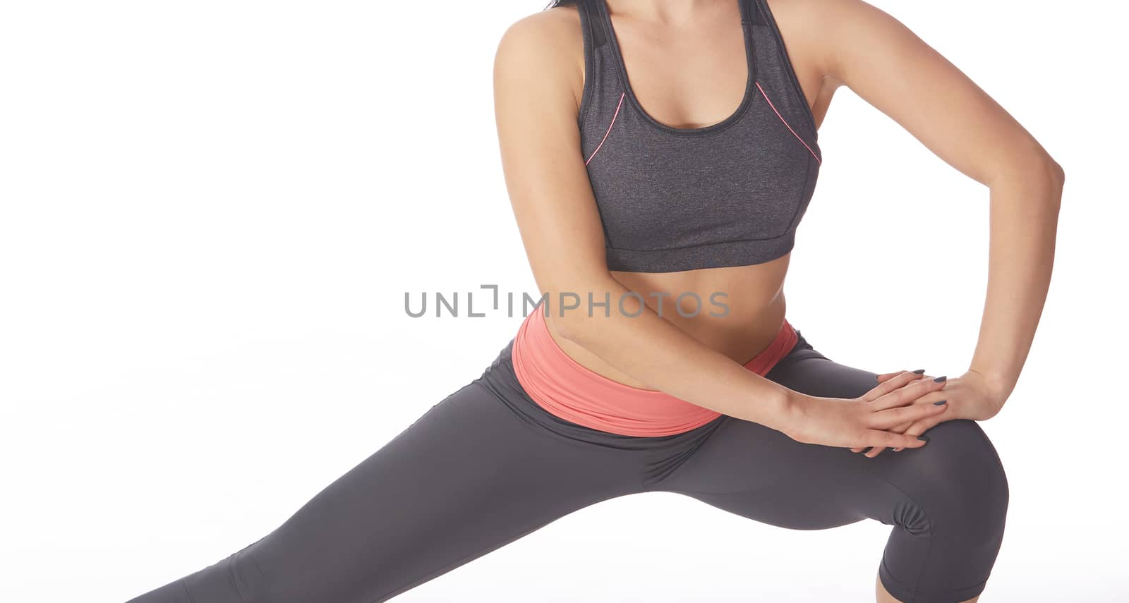 Woman doing fitness execrise on a white background