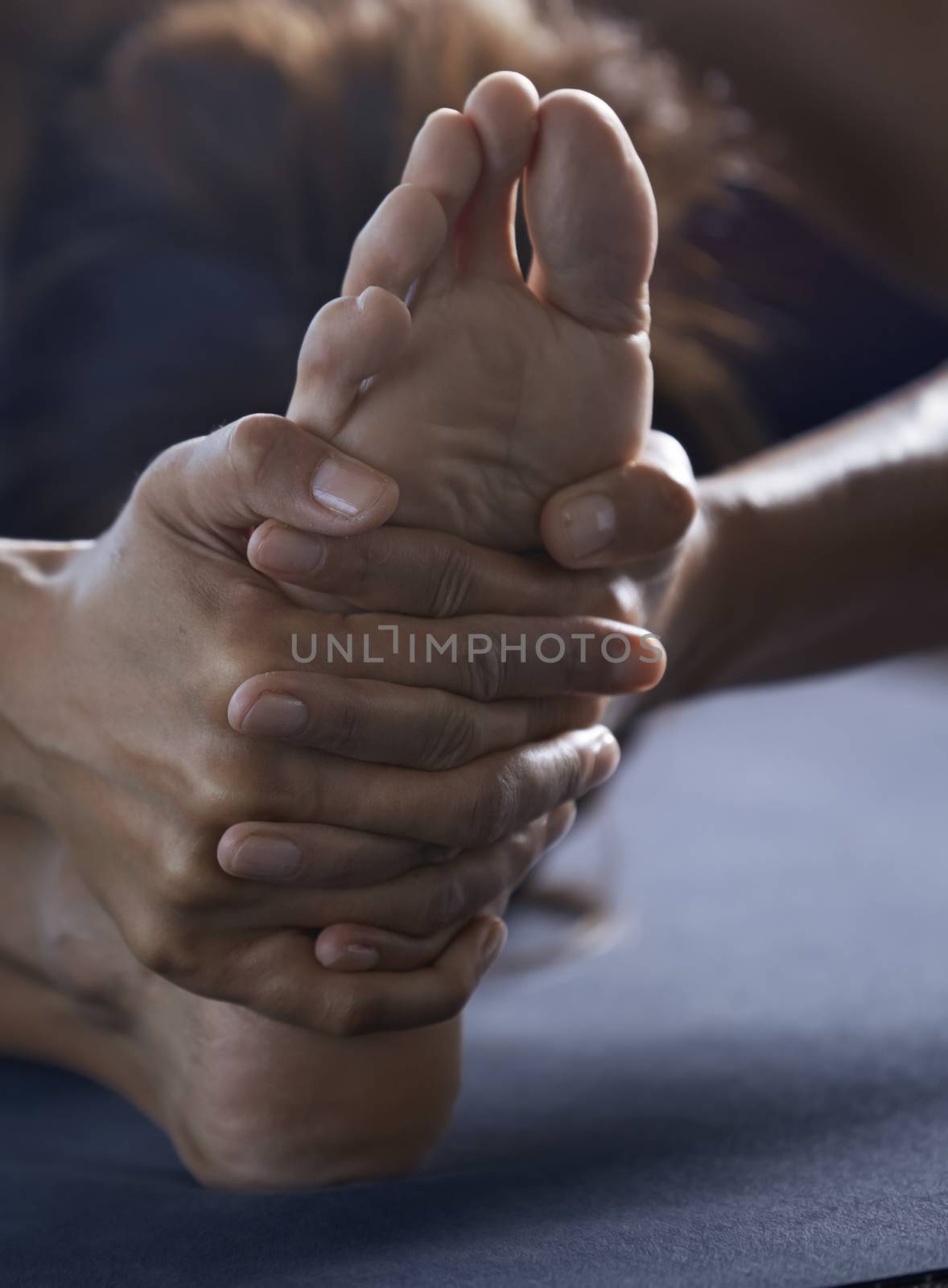 Close-up of the man doing yoga stretching exercise