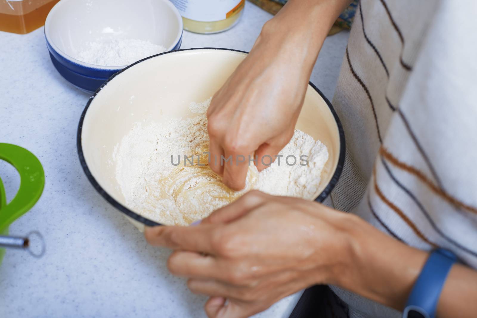 Hands of the woman preparing pie pastry by Novic