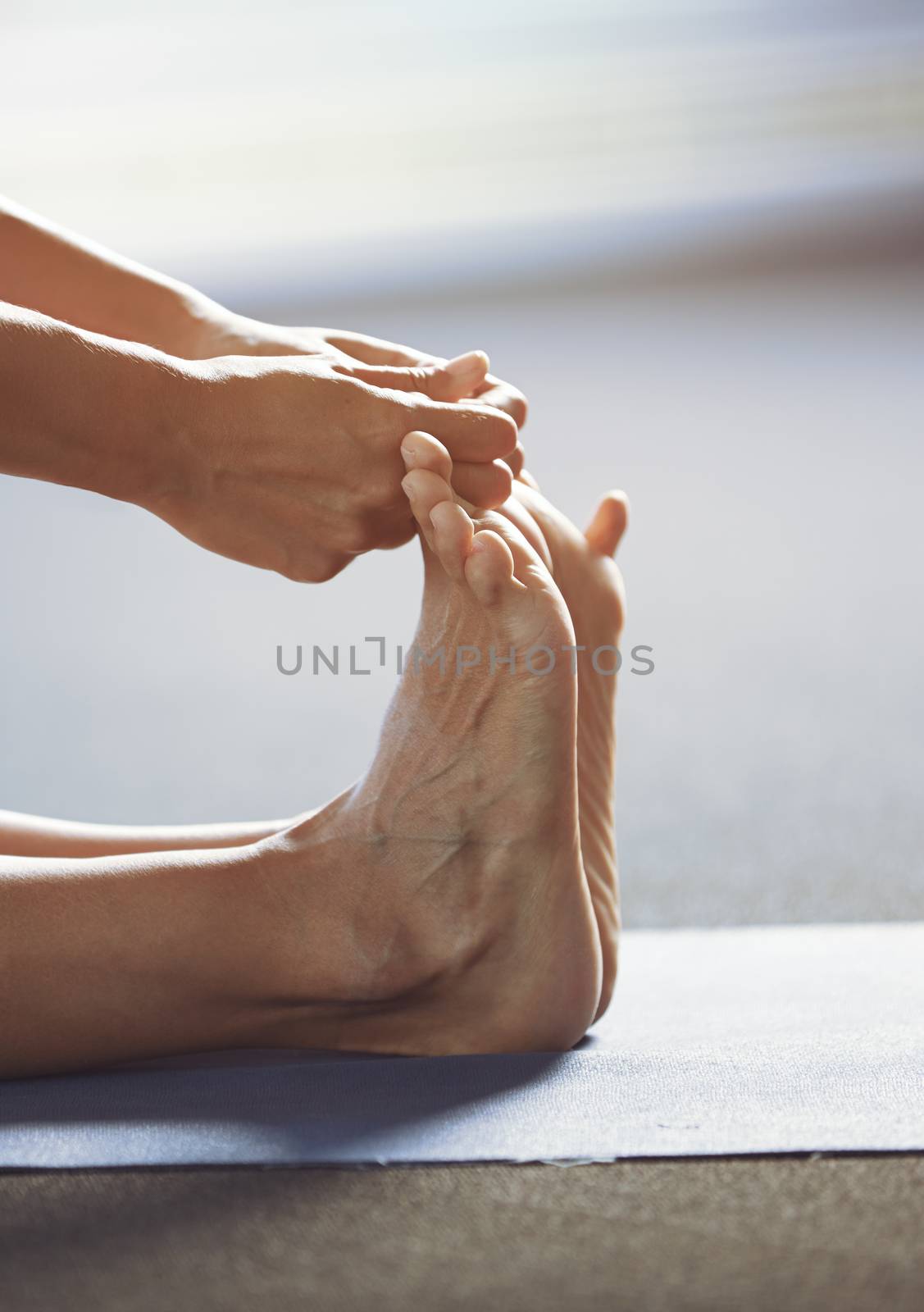 Close-up of the man doing yoga stretching exercise