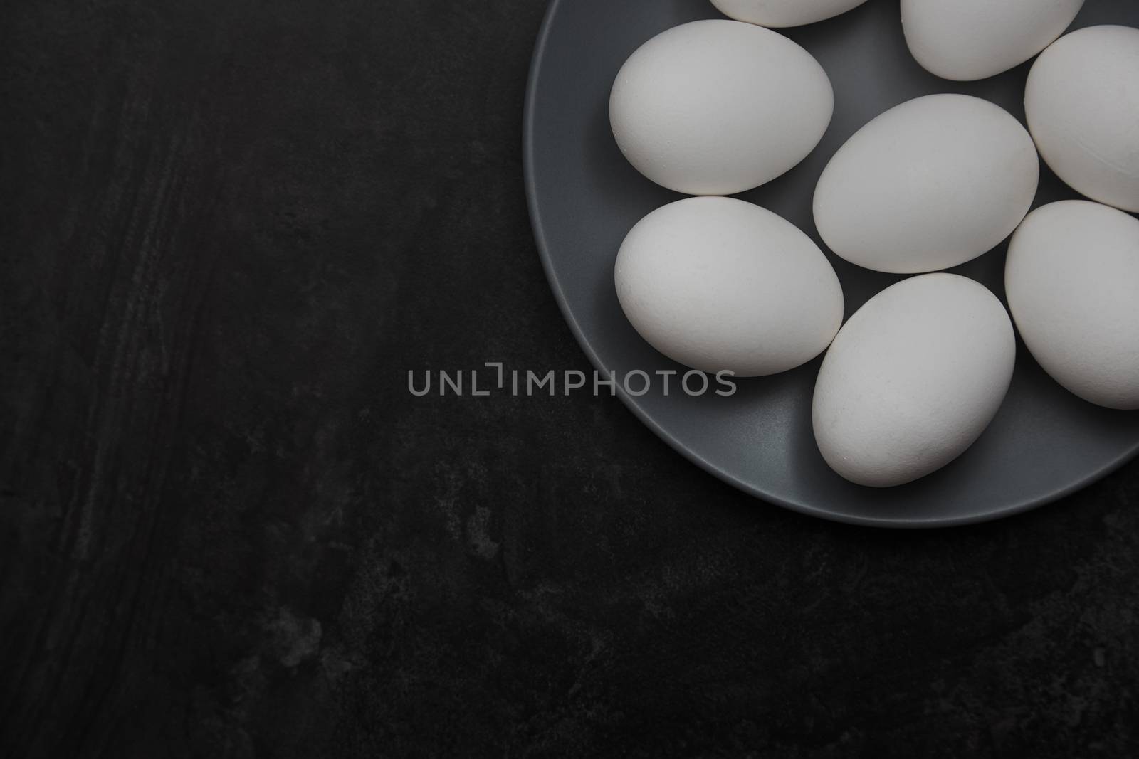 Chicken eggs on a plate. View from above