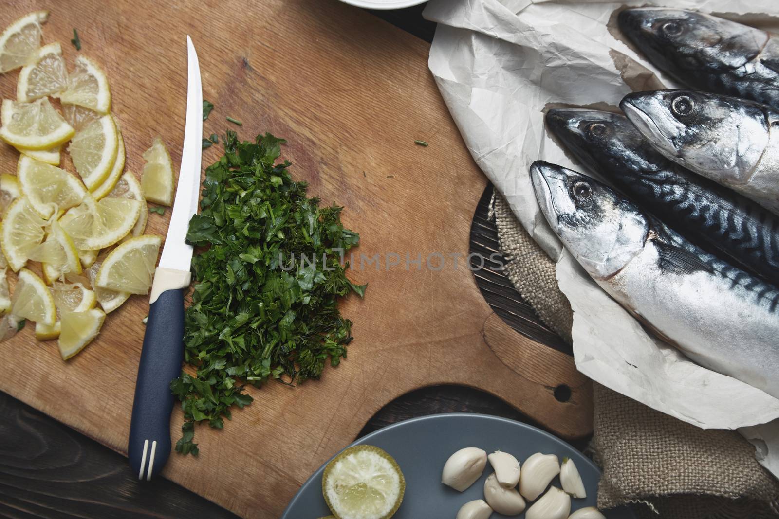 Fish ready to be stuffed by lemon and herbs with pepper