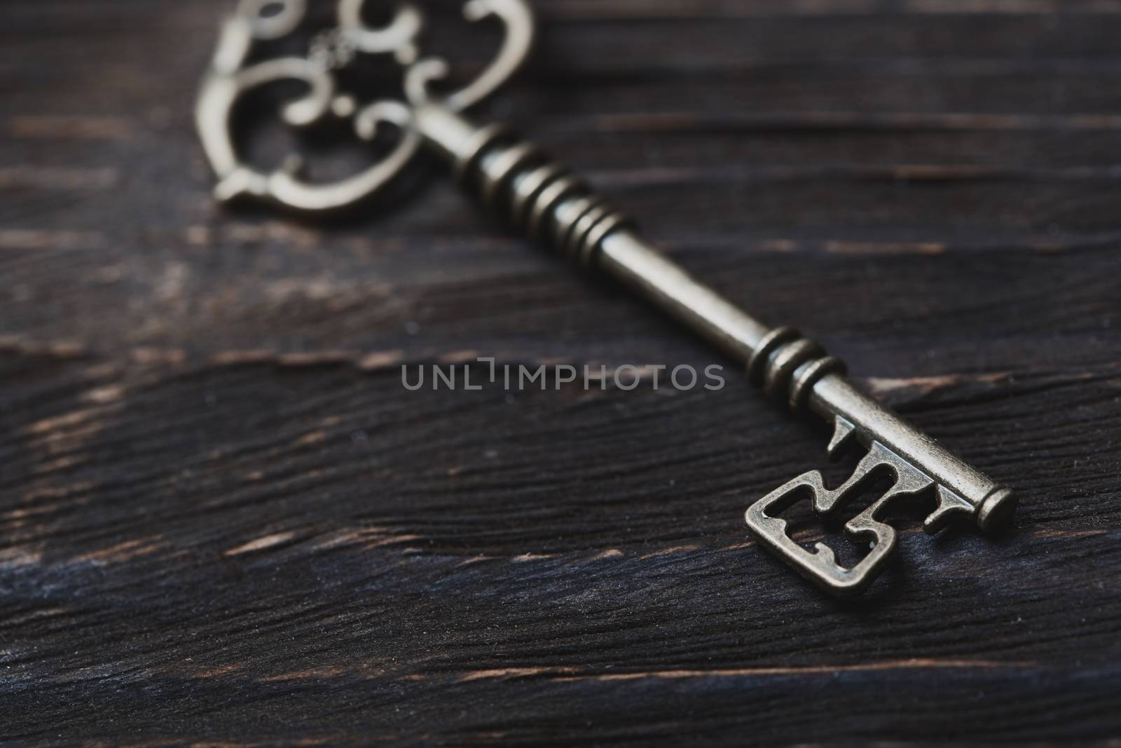 Vintage skeleton key on a table. Close-up