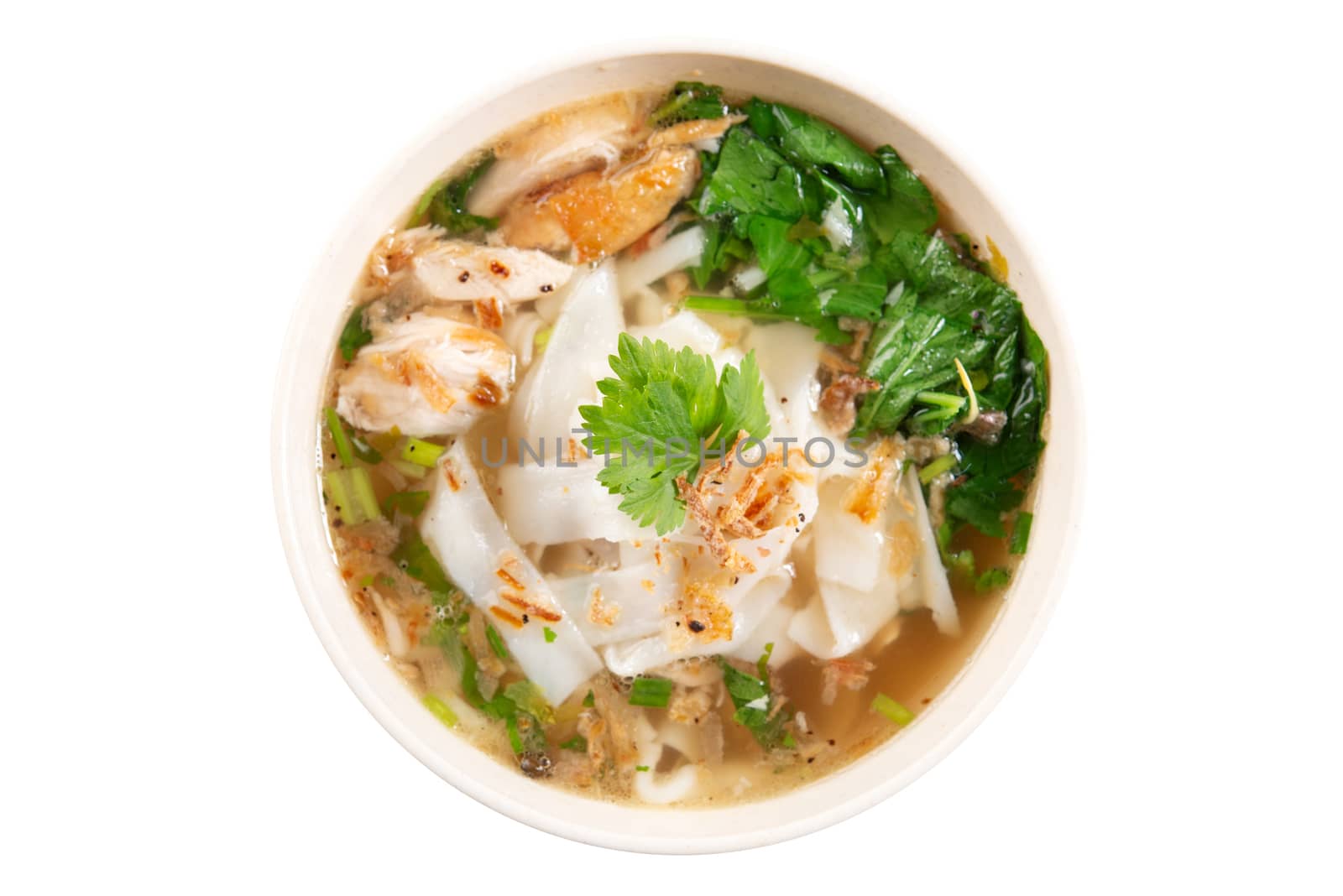 Asian kway teow soup noodles and chicken in bowl. Top view flat lay isolated on white background.