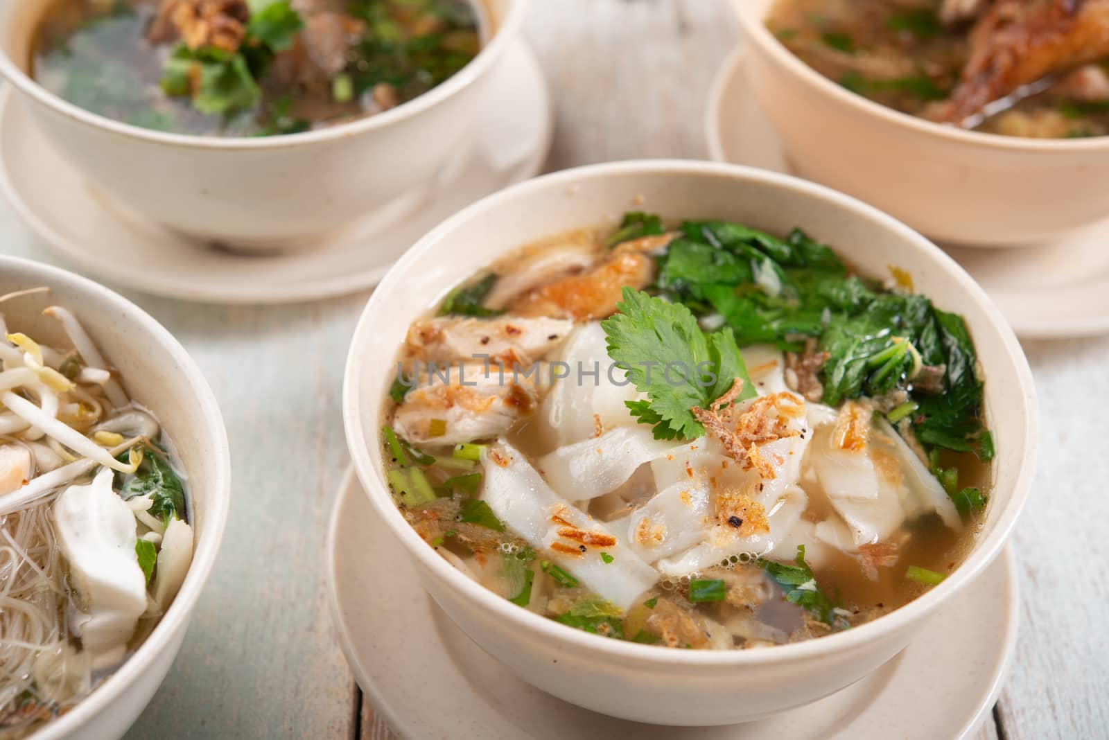 Various Southeast Asian dishes, noodles and soup.