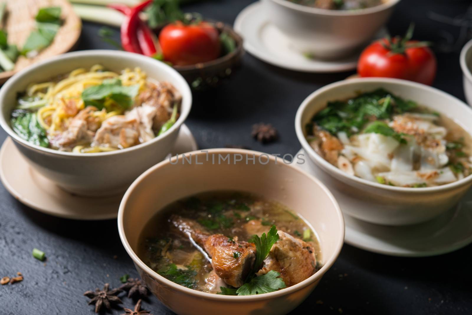 Various Southeast Asian dishes, noodles and soup.
