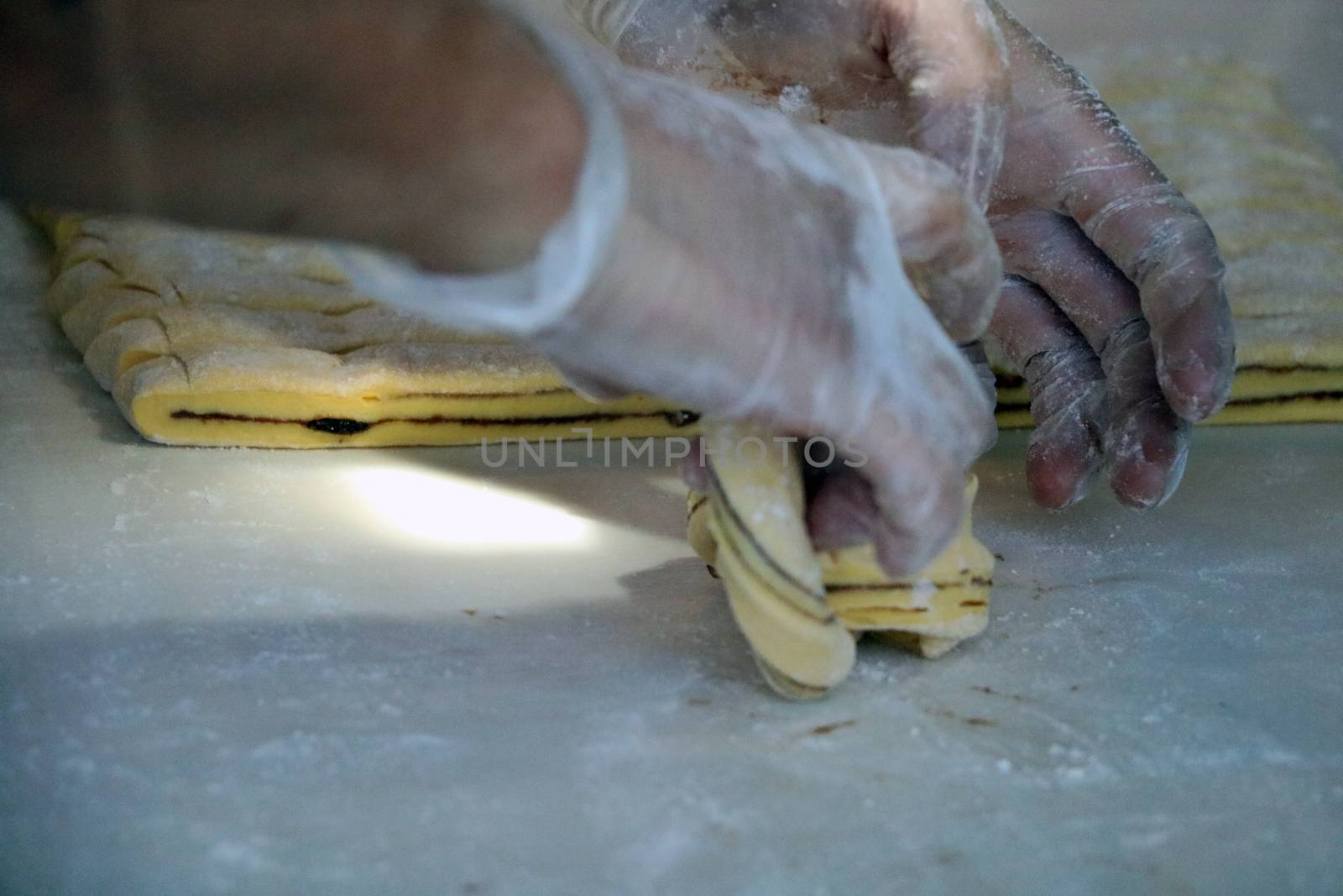 woman's hands making cookies for the holiday