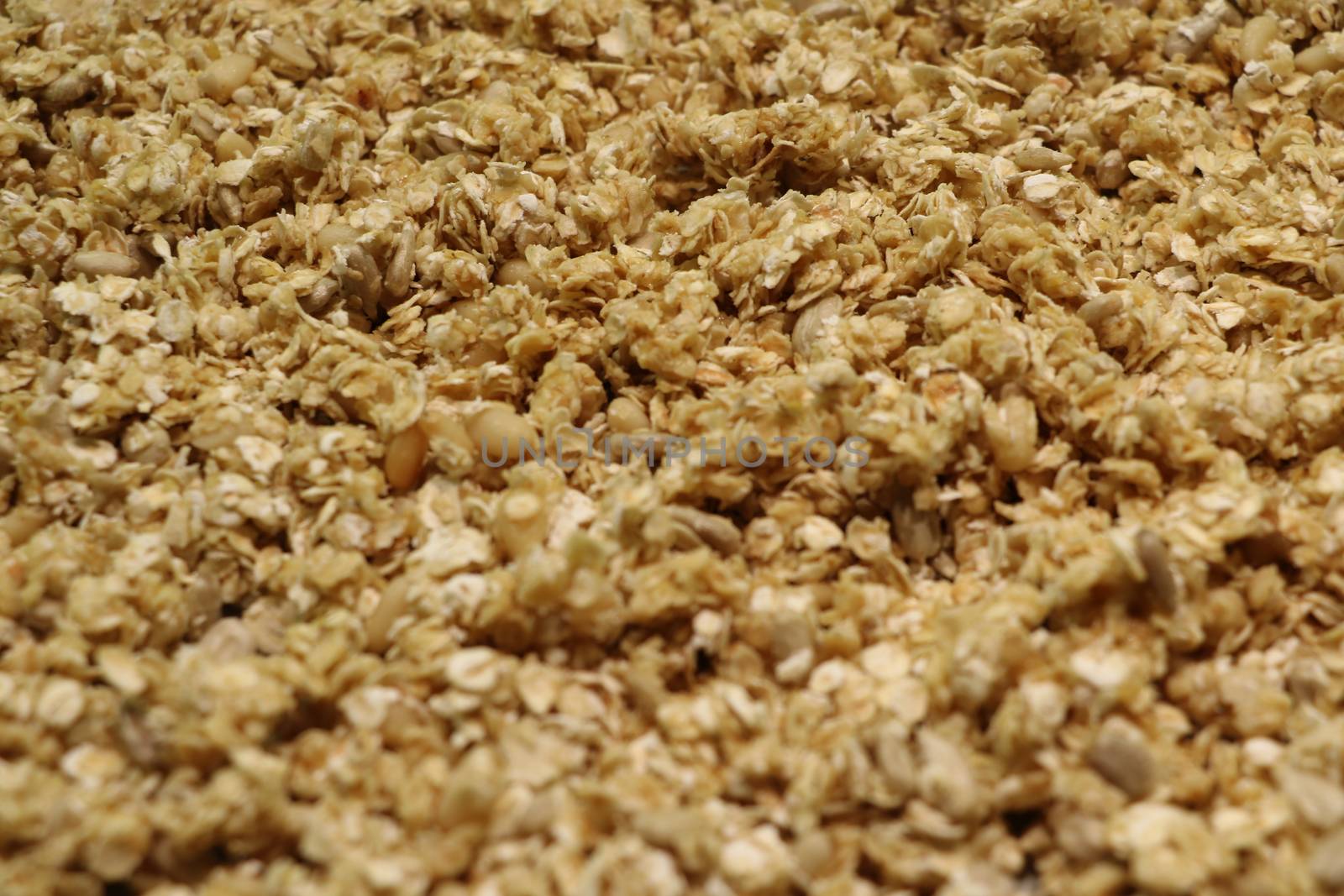 Organic homemade Granola Cereal with oats and almond. Texture oatmeal granola or muesli as background. Top view or flat-lay. Copy space for text. by kip02kas