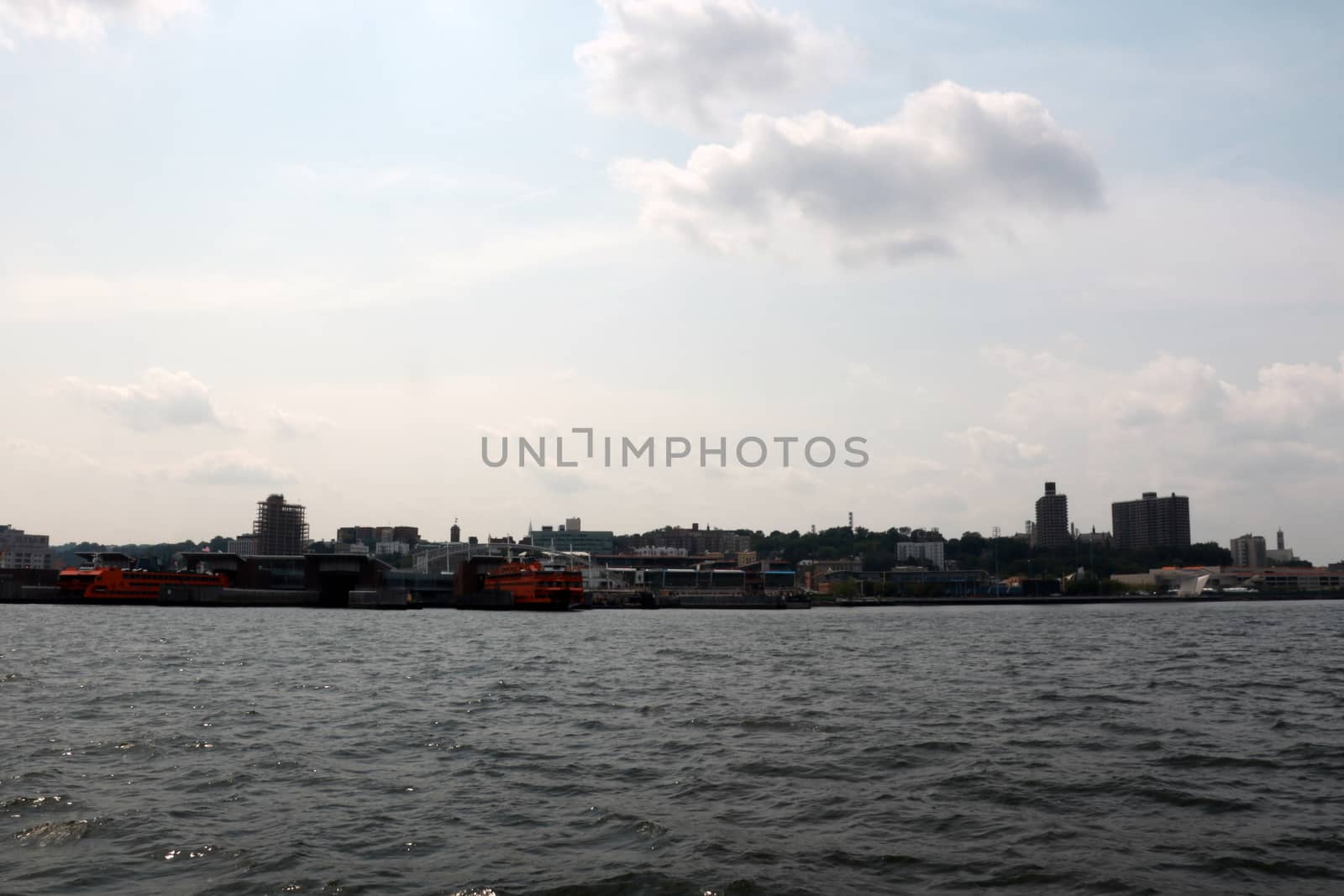 View of the city on a cloudy day from the water. by kip02kas