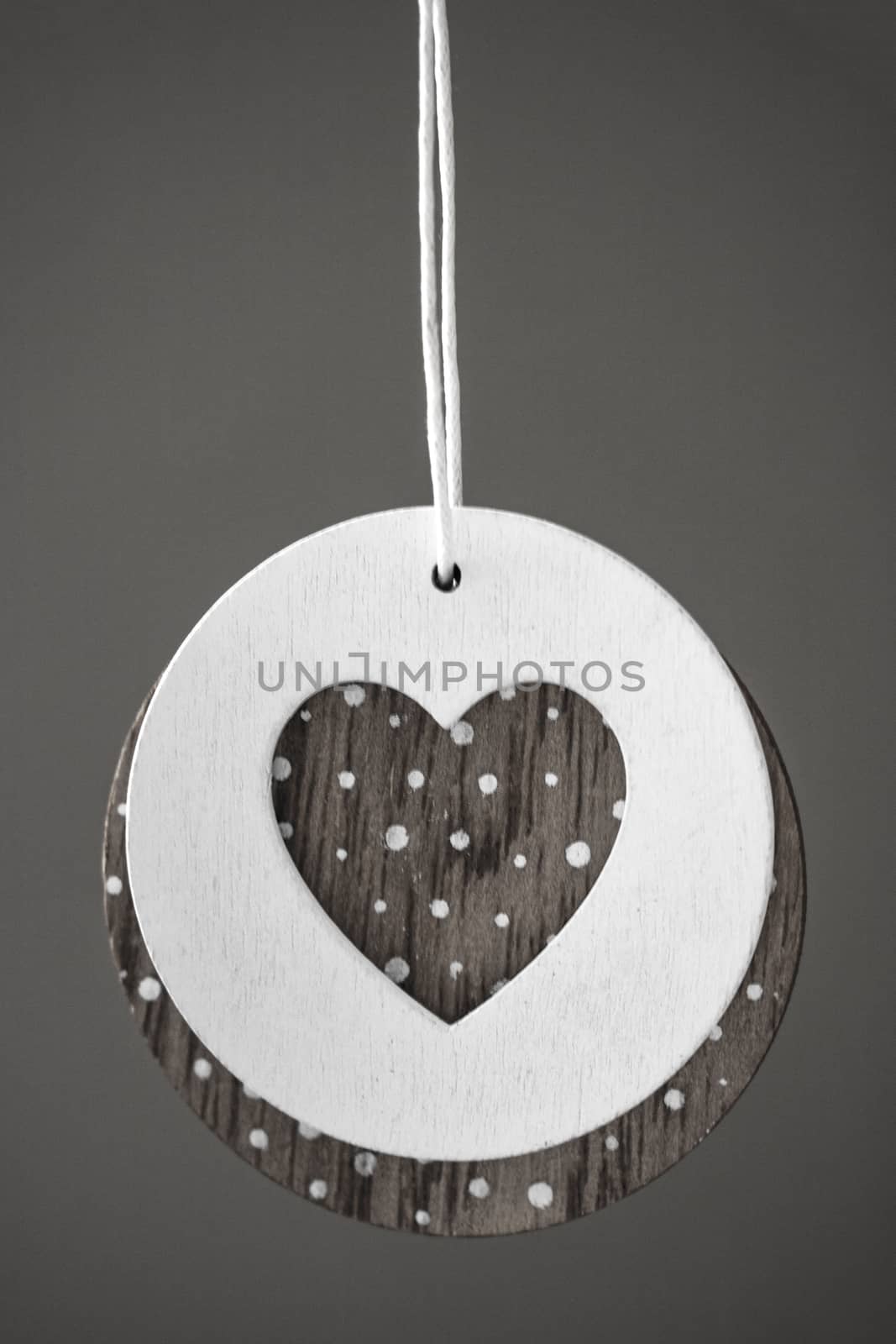 Love heart hanging on wooden texture background, valentines day card concept. by kip02kas