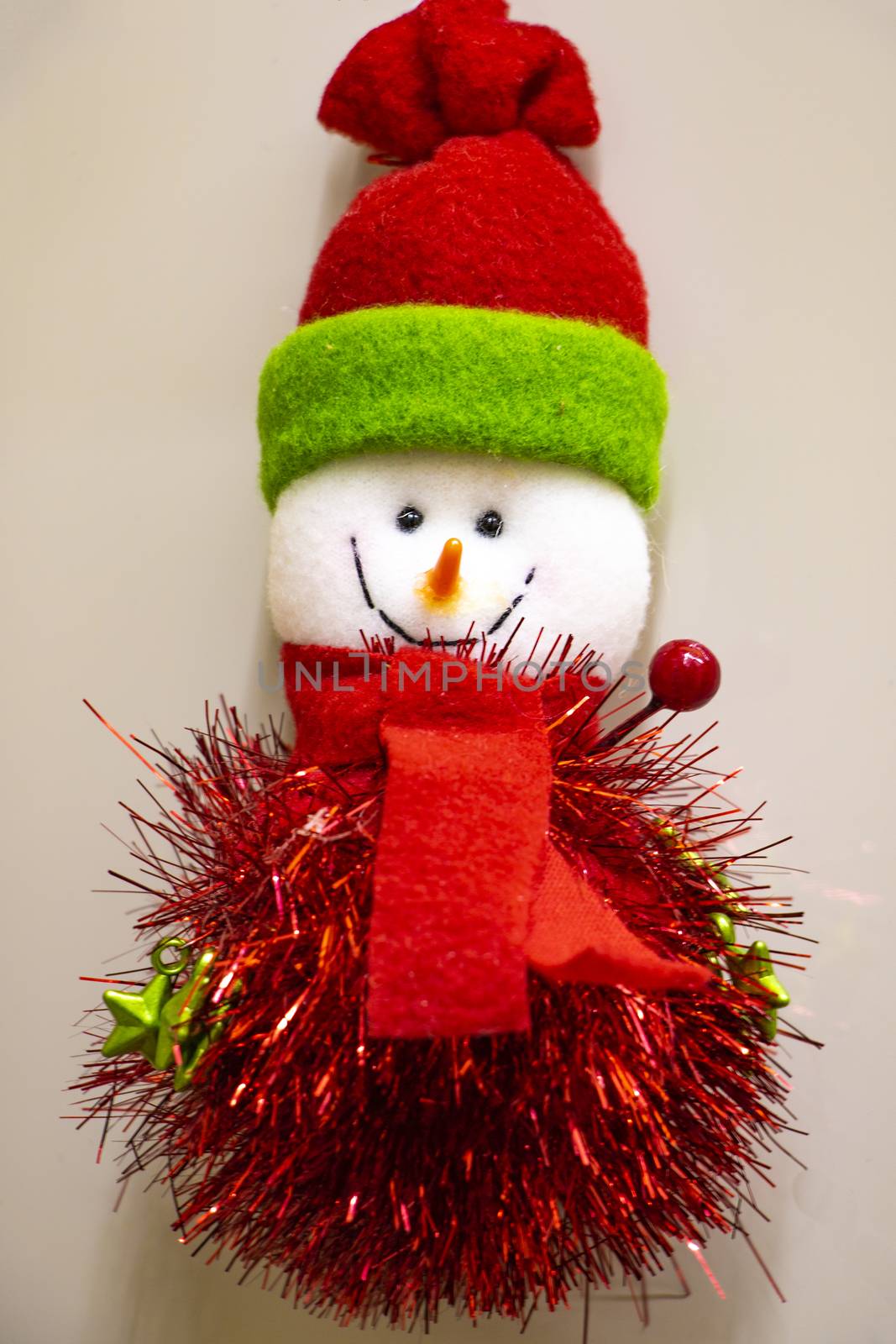happy snowman in knitted hat and scarf and mittens isolated