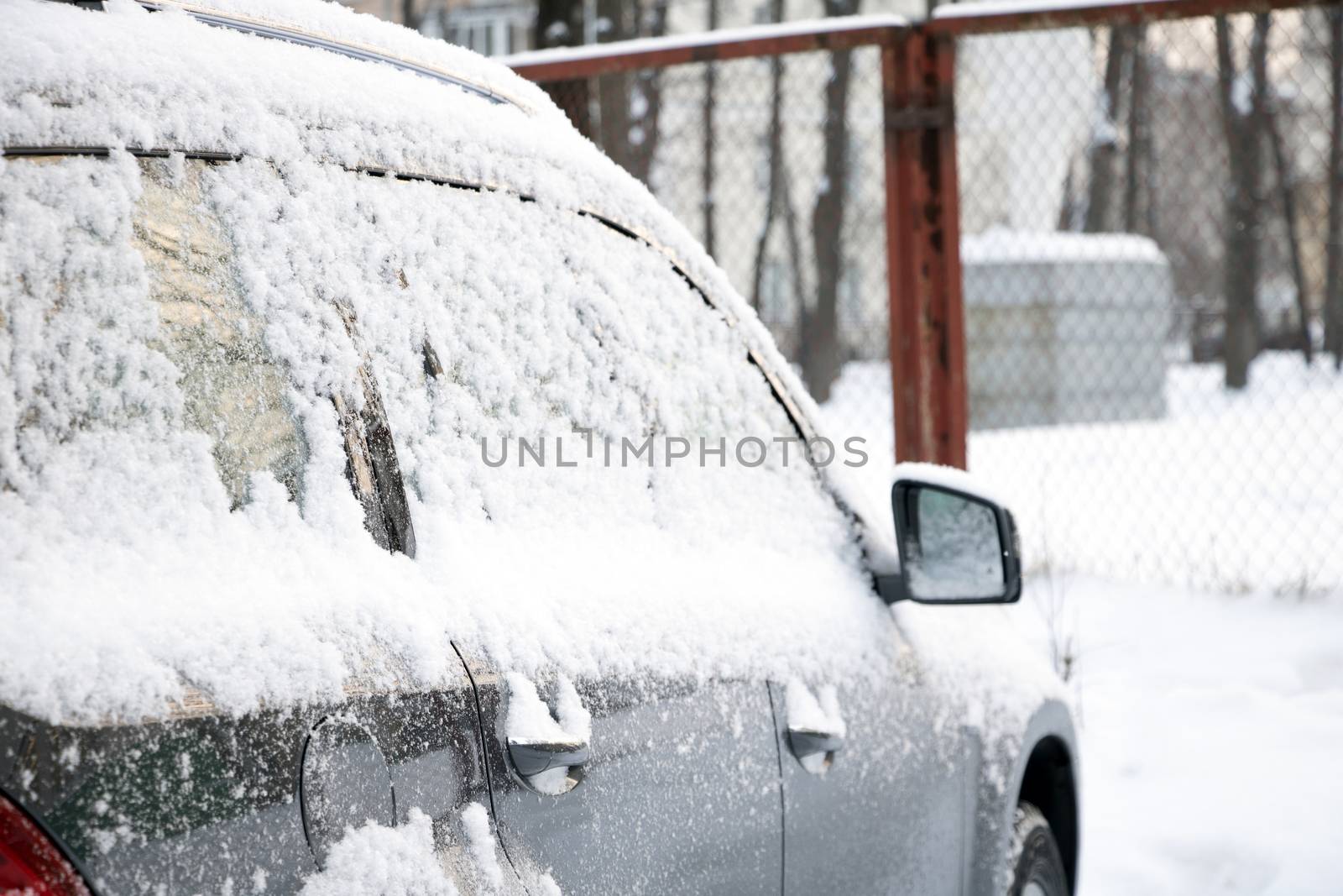 frozen car window closeup snow ice crystals cold weather