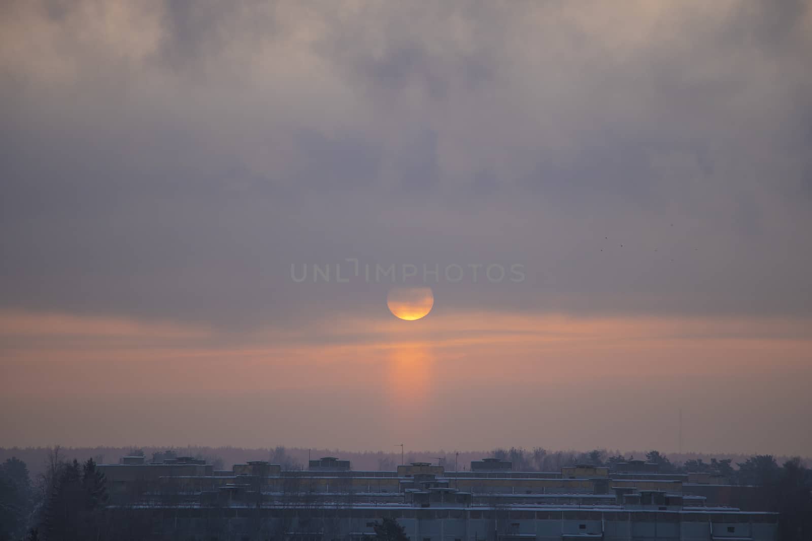 Winter dawn and the frosty fog. The sun rises over a small town. by kip02kas