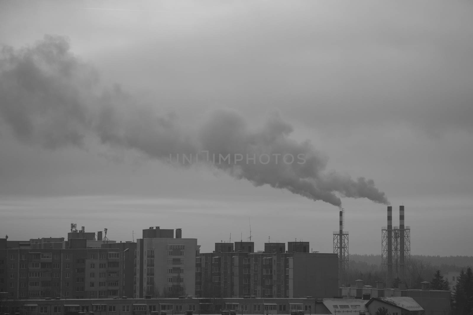 smoke from the chimney of a city boiler house in the morning on a frosty day. by kip02kas