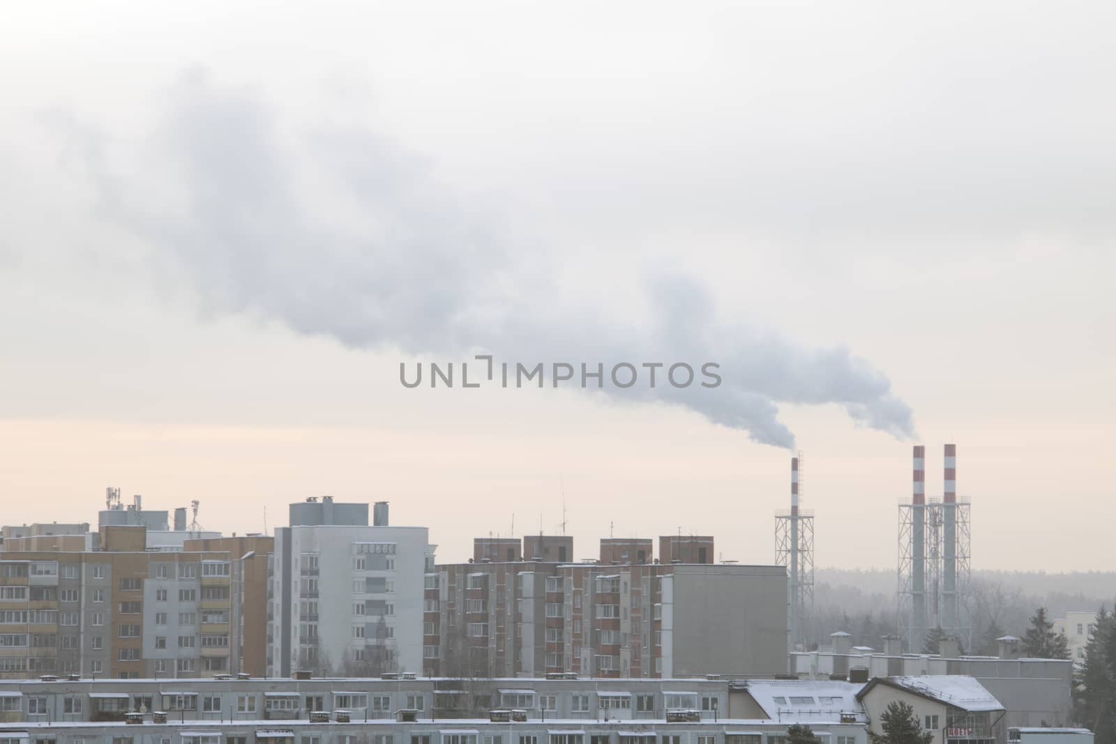 Industrial landscape smoke from the chimney of a large plant in winter. by kip02kas