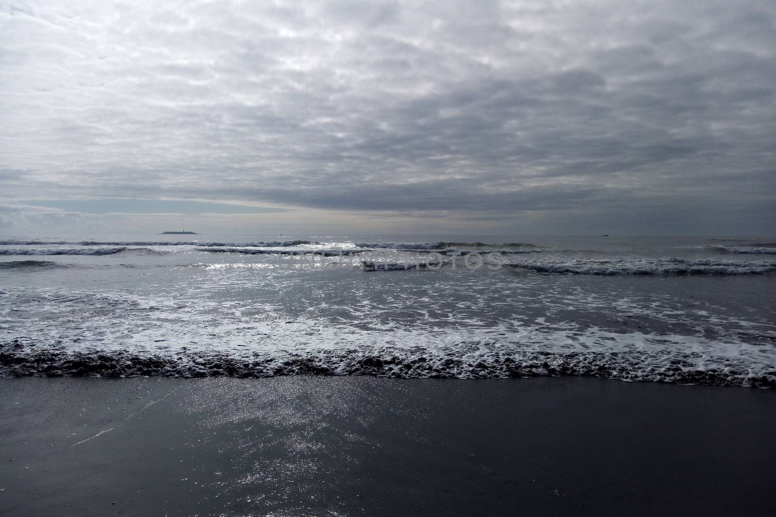 Closeup of foam on a beach ocean, seascape