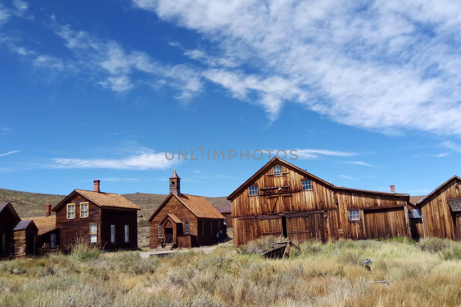 Empty streets of the abandoned ghost town of Bodie in California, USA in the middle of the day. by kip02kas