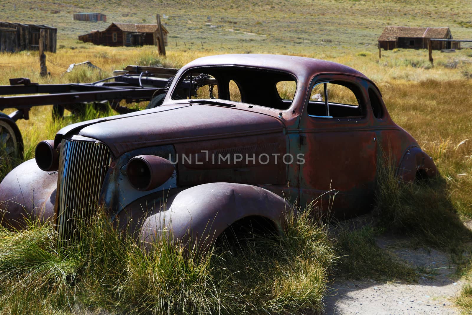 Old car: old car, rusty, in a field, in a historic ghost town, Bodie. by kip02kas