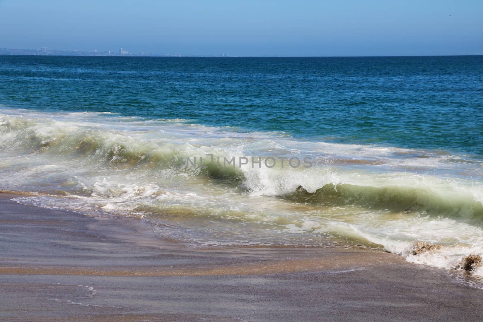 View of White Wave Receding on Perfect Sandy Beach