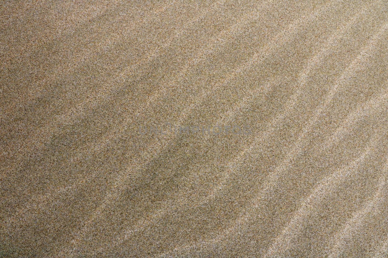Traces of water in the sand top view, background, texture
