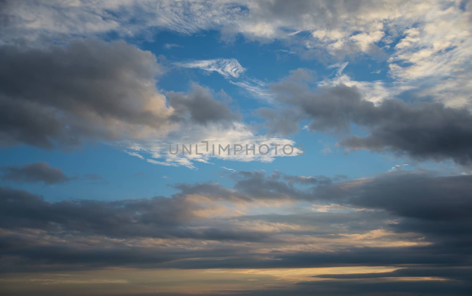 Beautiful dramatic sunset sky with dark clouds