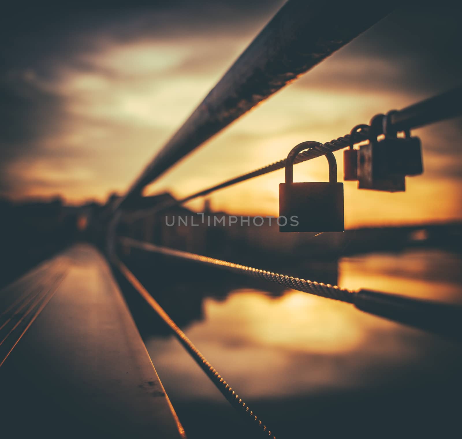 A Padlock Symbolising Love On A Bridge In Paris During A Beautiful Sunset
