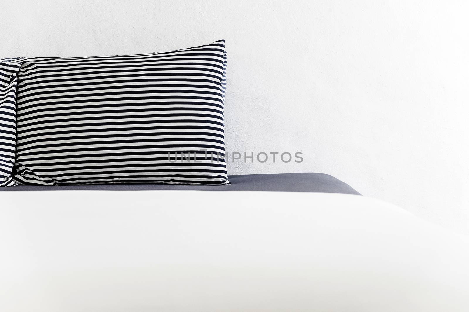 Closeup Modern style bedroom with pillows on bed