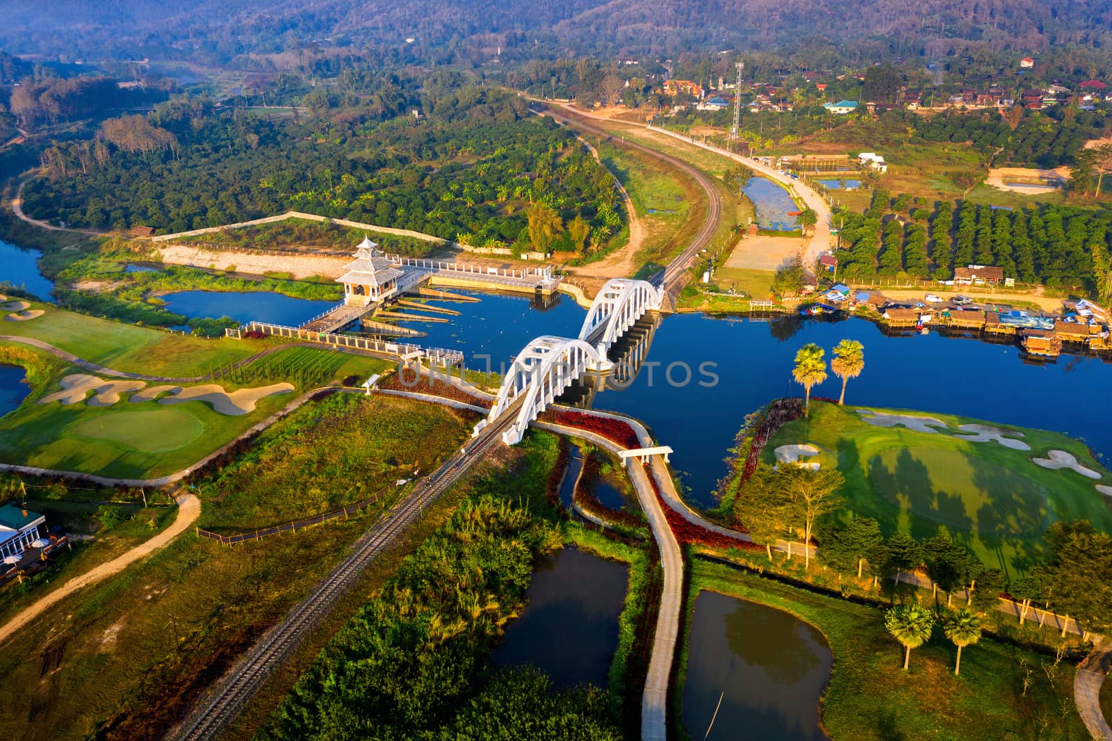 Aerial of Thachomphu Railway Bridge or White Bridge in Lamphun, Thailand. by gutarphotoghaphy